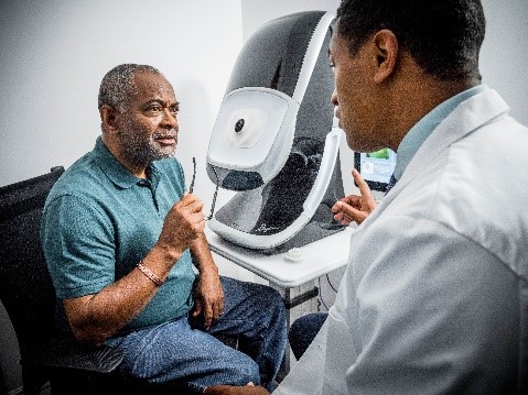 man in eye exam with male doctor